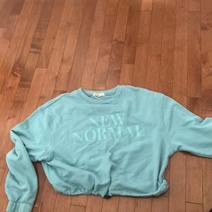 View details from pink sweater